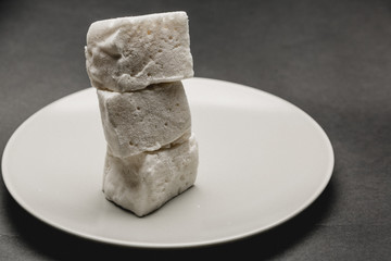 marshmallow cubes on white plate