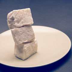 marshmallow cubes on white plate