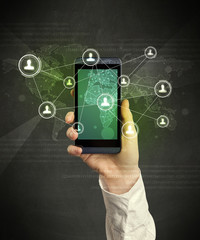 Caucasian hand in business suit holding a smartphone, social network concept