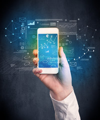 Caucasian hand in business suit holding a smartphone