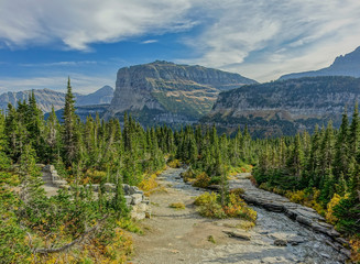 Glacier N.P., Montana, USA - September 24, 2015:  Valley formed between the Waterton and Belly rivers where the Stoney Indian Trail passes, with alpine views under a blue sky with scattered clouds
