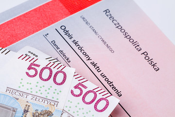 Five hundred polish zloty on birth certificate, concept of polish social program named 500 plus.