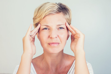 Fototapeta premium Headache and stress beautiful young woman feeling strong head pain portrait of tired stressed