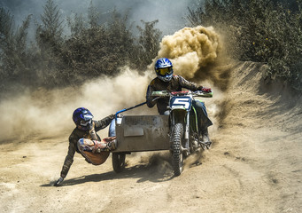 Fototapeta na wymiar motocross motorbike with sidecar motorcycle trailer dust dirt