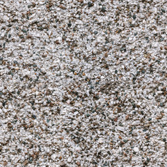 Wall with small stones. Seamless texture.
