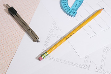 Projects and graph paper with pencil and compass composition