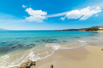 Turquoise water in Le Bombarde beach in Alghero