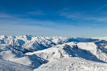 Fototapeta na wymiar Amazing view to Alps from the mountain top at the french ski resort Three Valleys, Meribel, Courchevel, France.