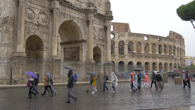 Arch of Constantine and the Colosseum on a rainy day