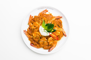 Curry-fried shrimps isolated on a white background. Thai food. Copy space. For design. Thai food concept.