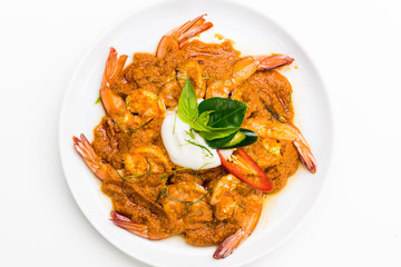 Curry-fried shrimps isolated on a white background. Thai food. Copy space. For design. Thai food concept.