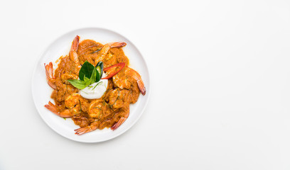 Curry-fried shrimps isolated on a white background. Thai food. Copy space. For design. Thai food concept.