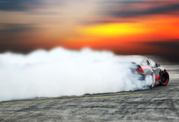 Blur of image car drifting on motion blur track.