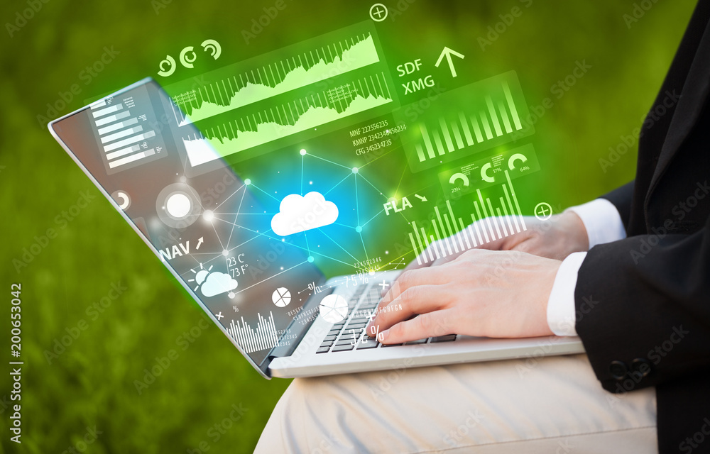 Aufkleber hand using laptop with cloud technology and linked information concept