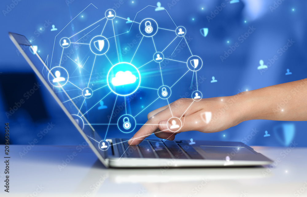 Poster Hand using laptop with centralized cloud computing system and network security concept
