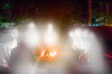 group of believers gathered nights and formed circle around candles
