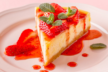 Delicious homemade cheesecake with strawberries.