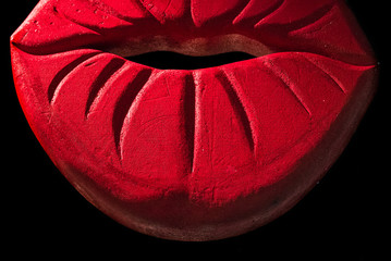 Red lips made of polystyrene. It is mainly used to decorate club, but also every type of space. Isolated in a black background
