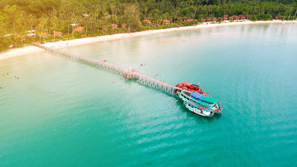 Obraz premium Cruise ships anchorage at wooden pier, Koh Kood, Trat (photo from drone)