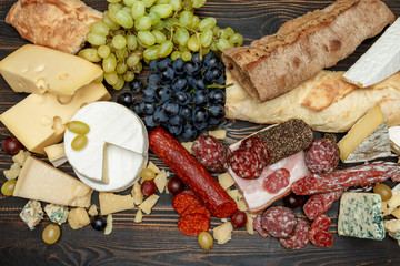 Traditional italian products with salami, cheese, bread and fruits