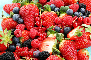 Fototapeta premium Berries overhead closeup colorful assorted mix of strawberry, blueberry, raspberry, blackberry and red currant