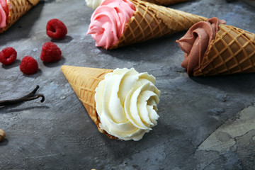 Vanilla frozen yogurt or soft ice cream in waffle cone