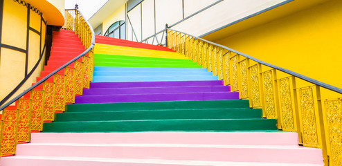 Stair with steps painted in rainbow colorful,..Interior Designers