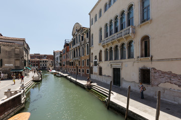 People walk, have breakfast on a square near Church of San Nicola da Tolentino