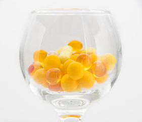 Cocktail from Capsule Dragee containing medicine, cod liver oil