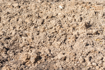 plowed land, beige relief texture,