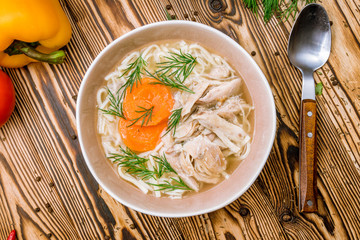 Chicken soup bouillon in a plate