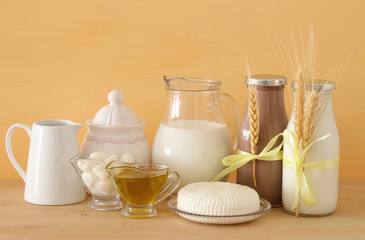 image of dairy products over wooden background. Symbols of jewish holiday - Shavuot.