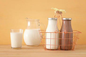 image of milk and chocolate over wooden table. Symbols of jewish holiday - Shavuot.