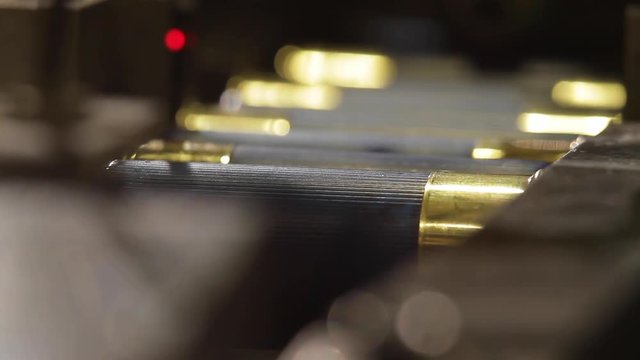 Process of production of bullets. Industrial concept. Factory equipment and macine.