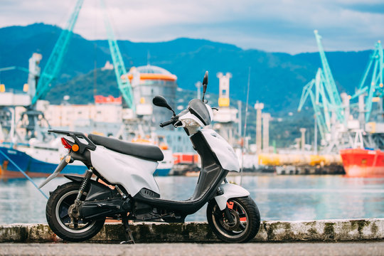 Motor Scooter Motorbike Motorcycle Bike Parked Against Sea Port Dock