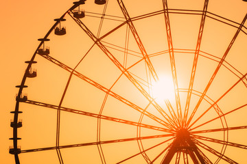 Sun Shining Through Ferris Wheel In Sunny Evening Sunset Time