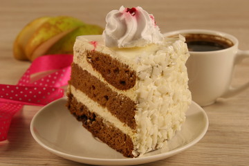 chocolate cake and cup of coffee on a wooden table