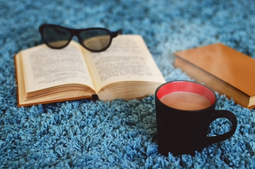 Reading. Coffee mug. Cozy atmosphere. Good time. Coffee with milk and reading an interesting book.
