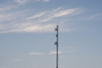 spotlight pole on blue sky and cloud.