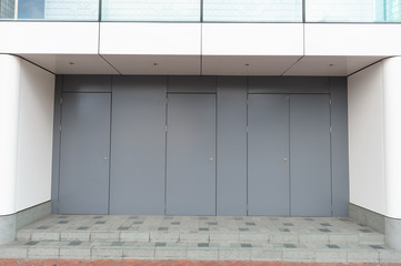 sidewalk by street wall & door