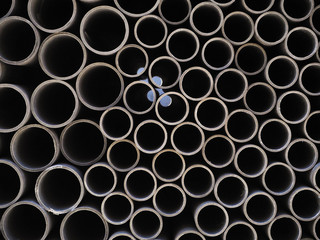 Asbestos cement pipes used for drainage construction. Texture for background.
