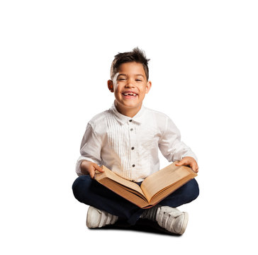 little boy reading a book on white background