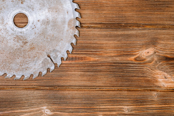 Circular saw blade on a wood board