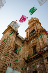 Colored flags outside the Parish of Our Lady of Guadalupe in Puerto Vallarta, Mexico