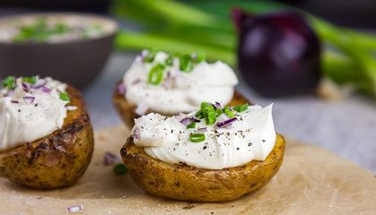 Baked jacket potatoes stuffed with curd and spring onion