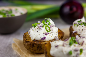 Baked jacket potatoes stuffed with curd and spring onion