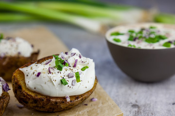 Baked jacket potatoes stuffed with curd and spring onion