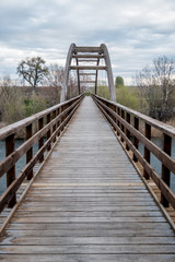 Fototapeta na wymiar wooden bridge cross river