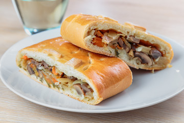 sliced pie with filling lies on the plate