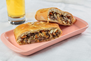 sliced pie with filling lies on the plate